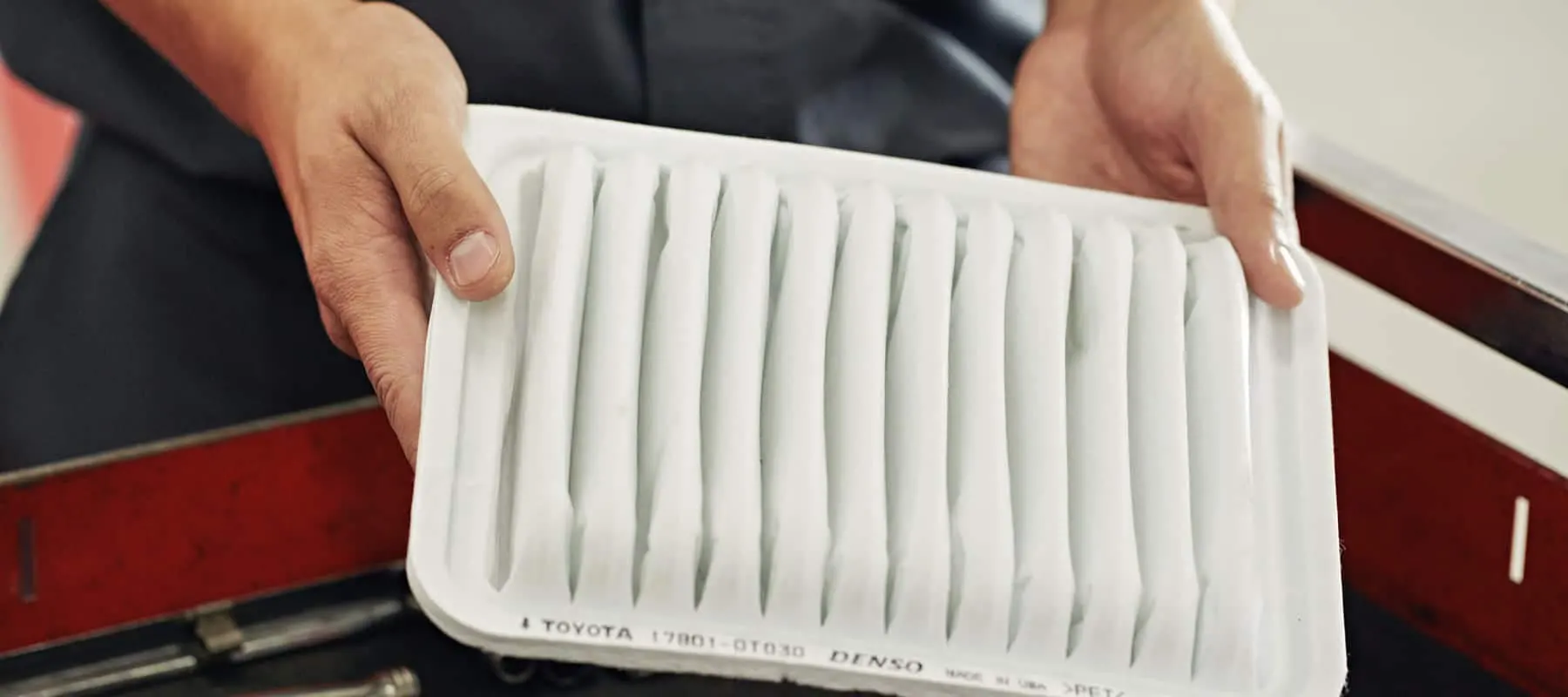 Toyota Cabin Air Filters at Freeman Toyota Closeup of hands holding Toyota cabin air filter