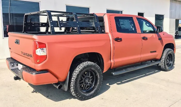 Freeman Toyota Premiium Upfitted Trucks Passenger side view Orange Toyota Tundra