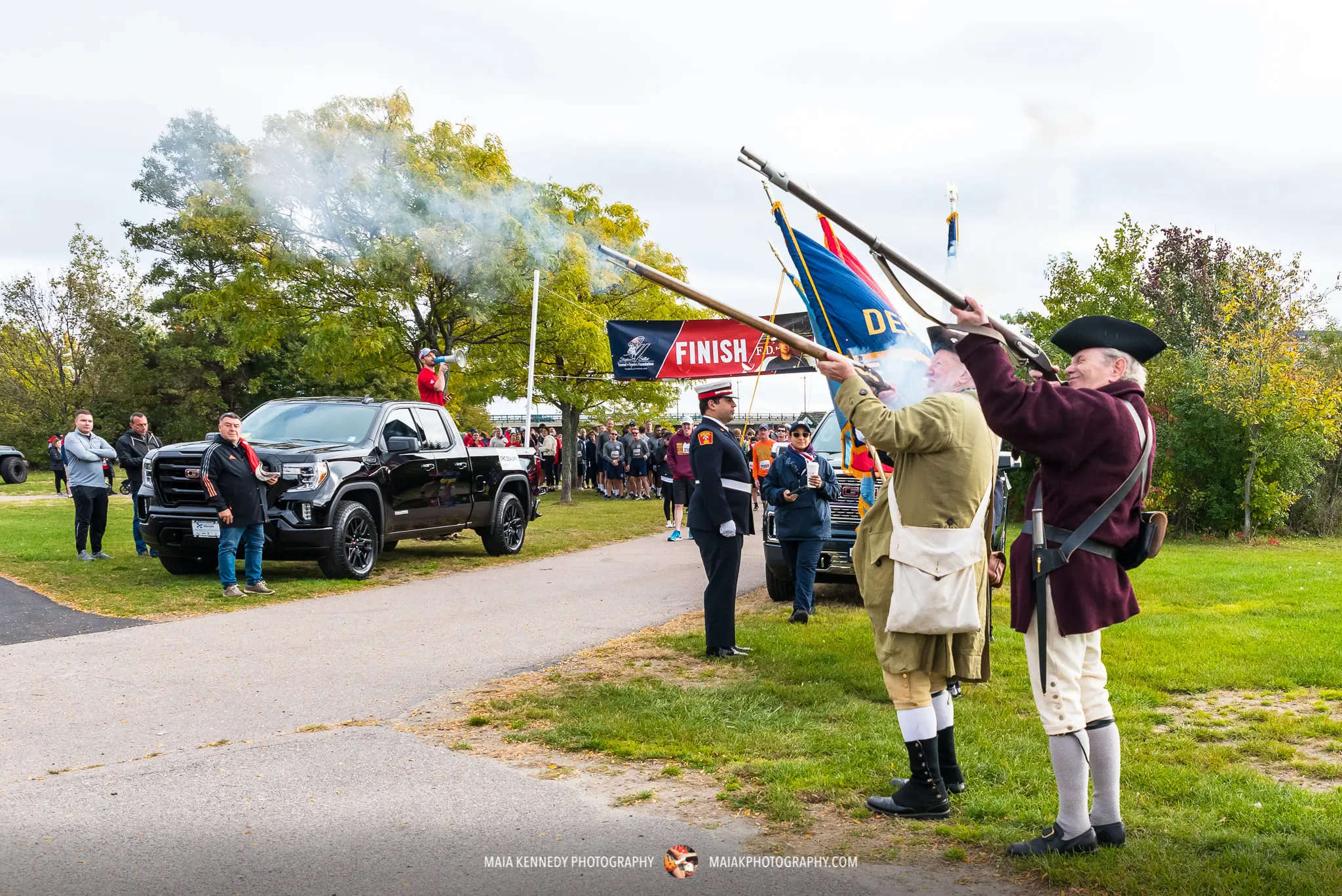 Group of men shooting muskets