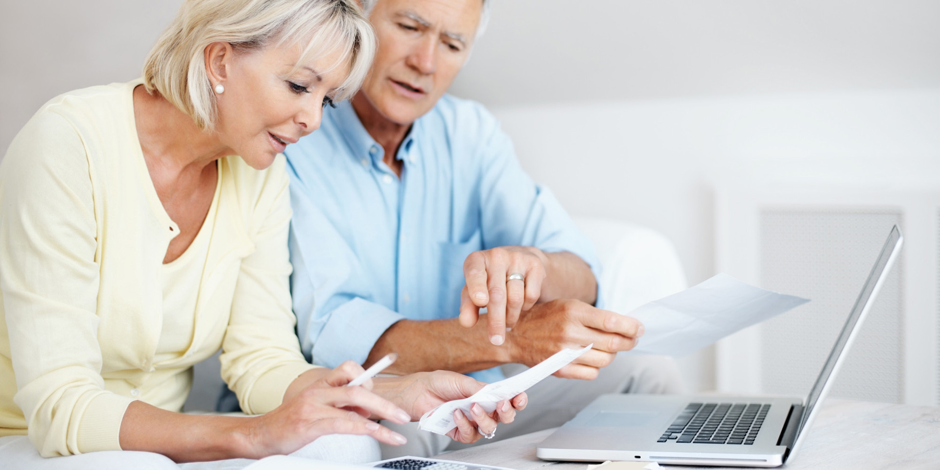 Should I lease or buy Kayser Chrysler Watertown Older couple looking at paperwork