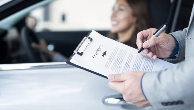 Kayser instant car offer Closeup of man holding vehicle contract