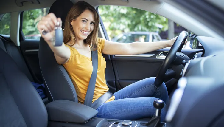 Kayser instant car offer Happy girl in car holding up car keys