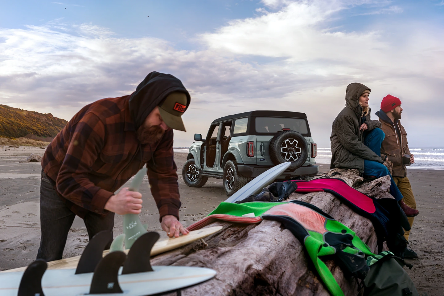 2022 Bronco for sale in Madison, WI Bronco in front of ocean with people and surf gear