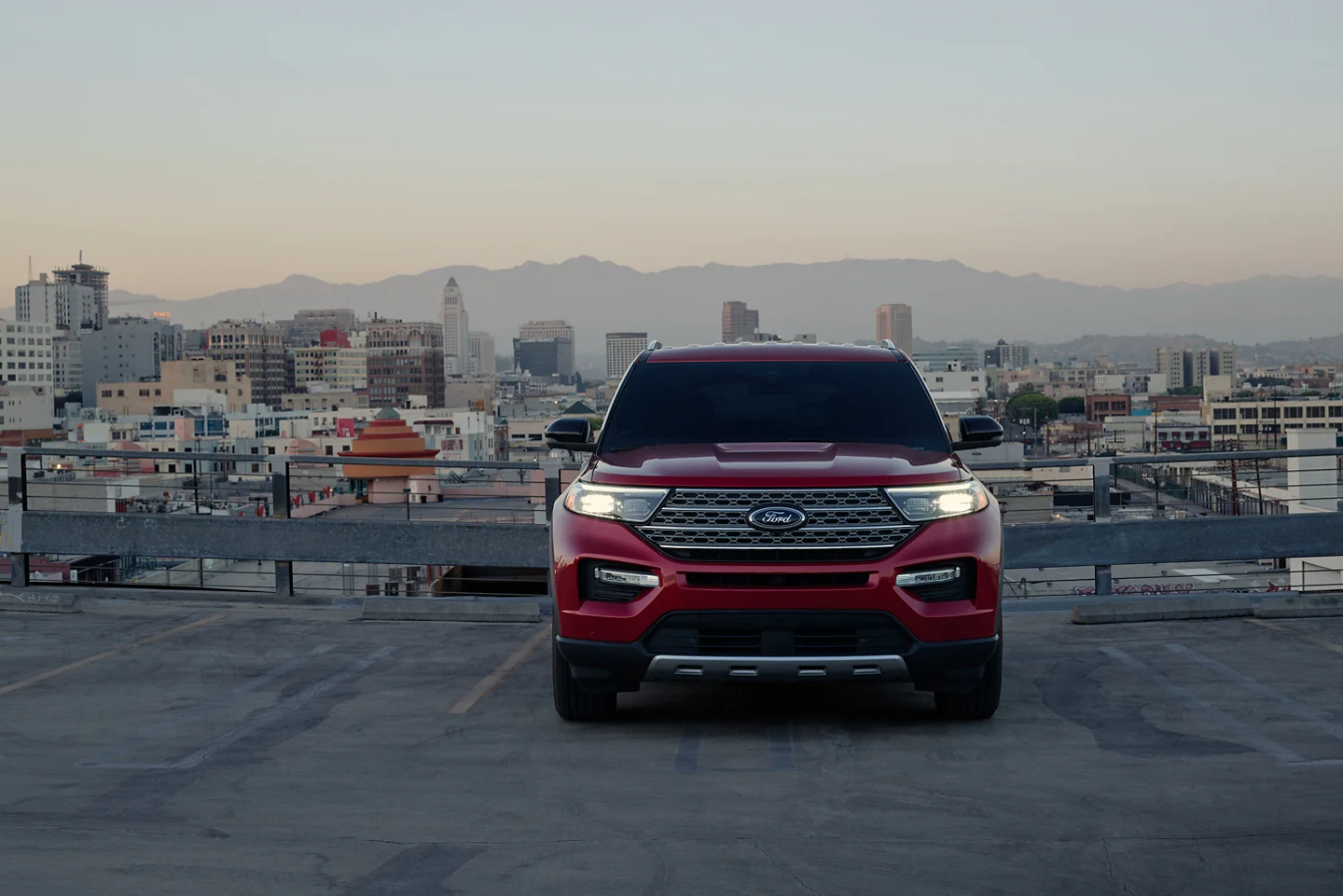 2022 Ford Explorer for sale in Madison, WI Red Ford Explorer parked in front of a city view