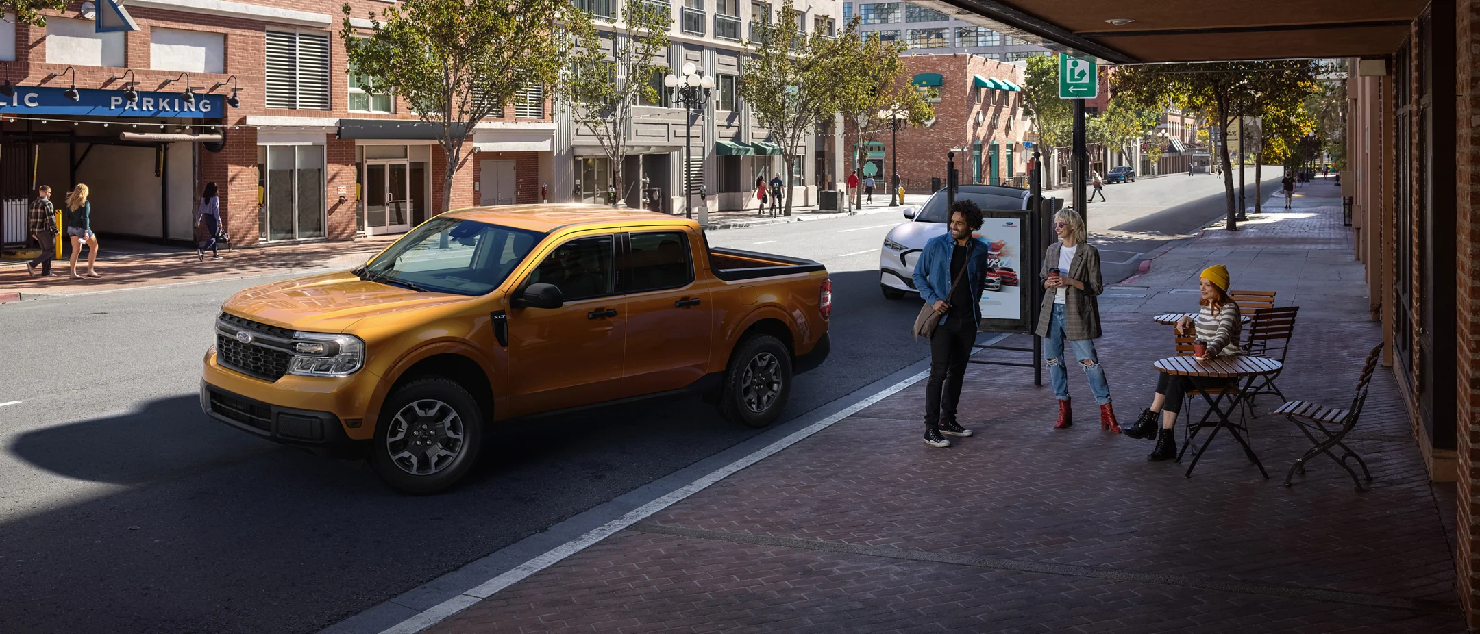 2022 Ford Maverick for sale in Madison, WI Yellow Maverick parked on a city street