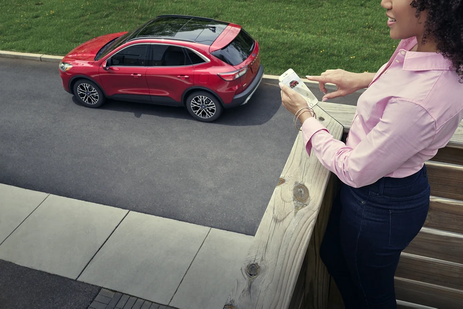 2022 Ford Escape for sale in Madison, WI Woman on phone connecting to FordPass Connect