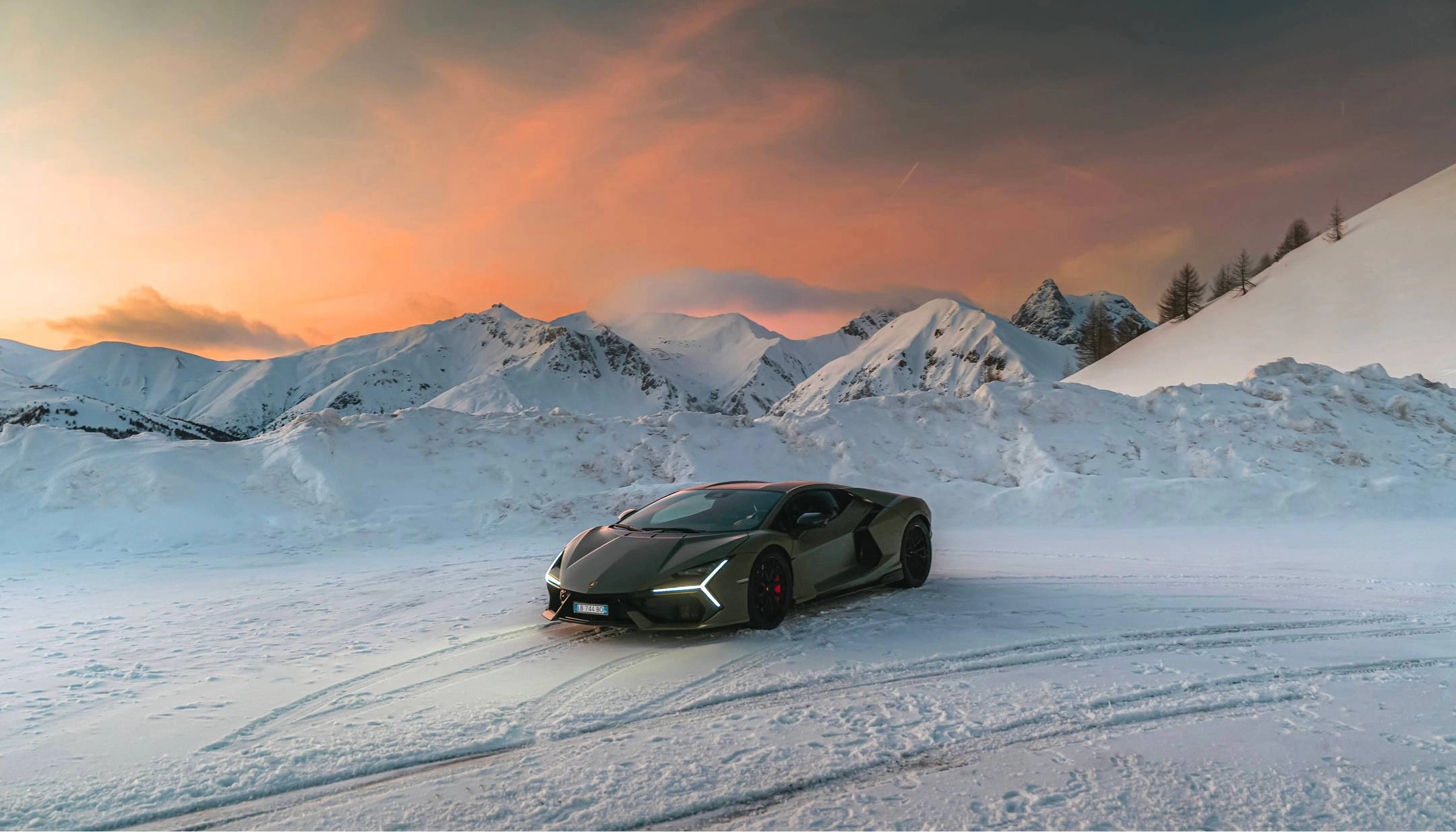 Lamborghini Revuelto parked in the snowy mountains