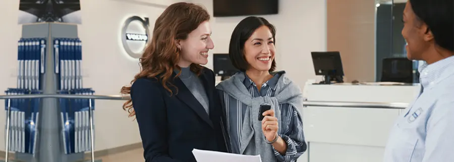 Volvo Lease-End Options Two women talking to a Volvo sales woman