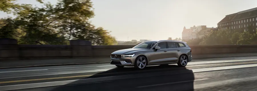 Volvo Lease Mileage 2021 Volvo V60 driving down the road