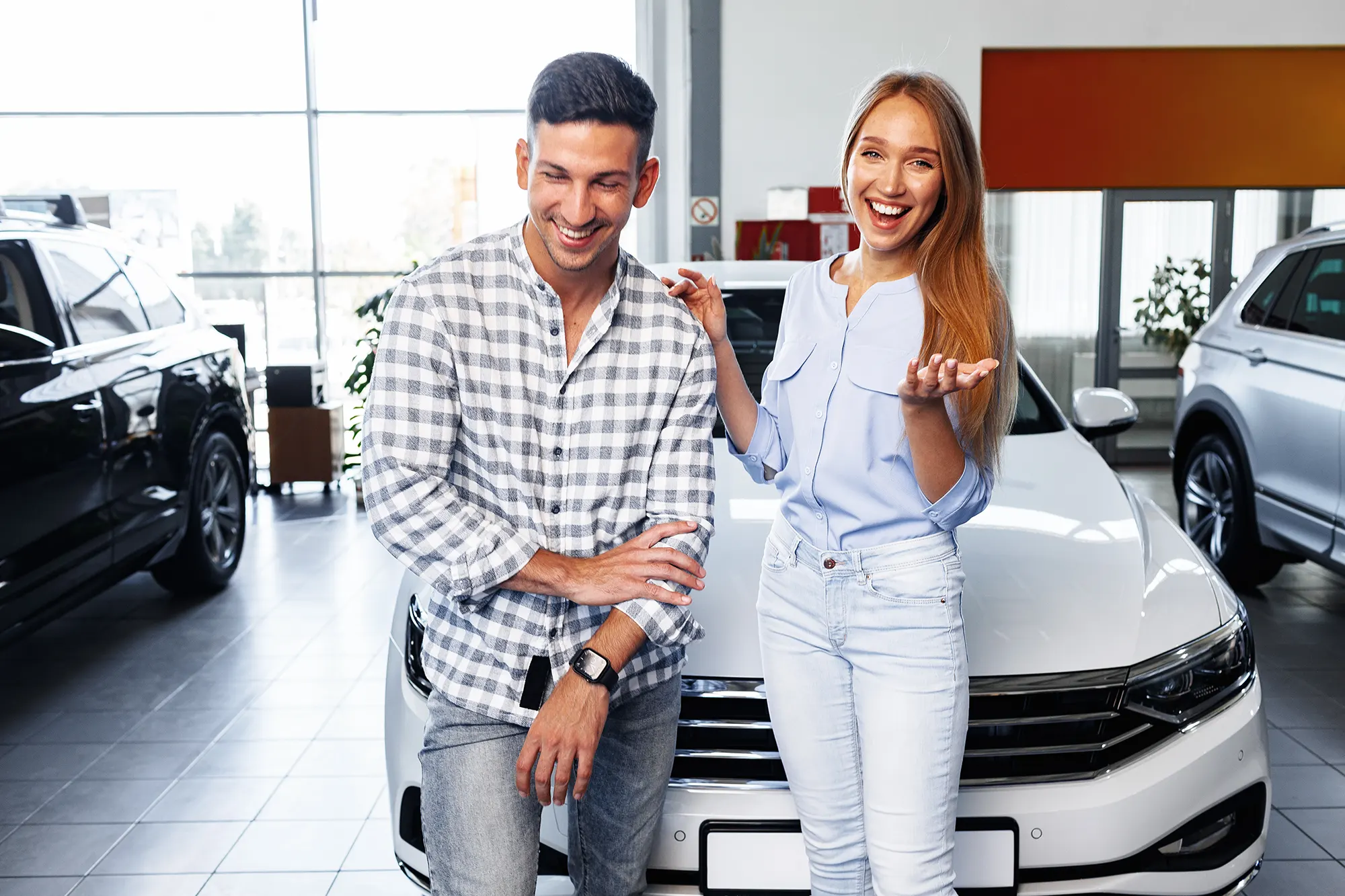 Smiling people at a volvo dealership