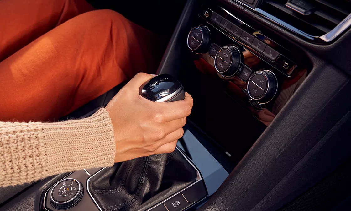 2022 Volkswagen Taos Interior A woman holding the gear stick in a 2022 Taos