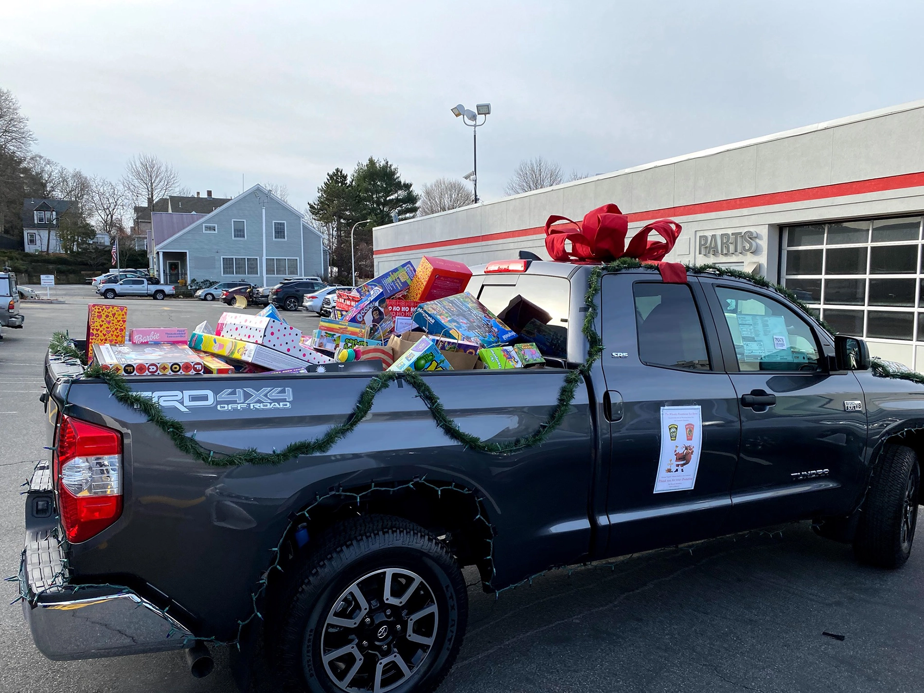 Lexus of Watertown Staff posing in front of the toy drive