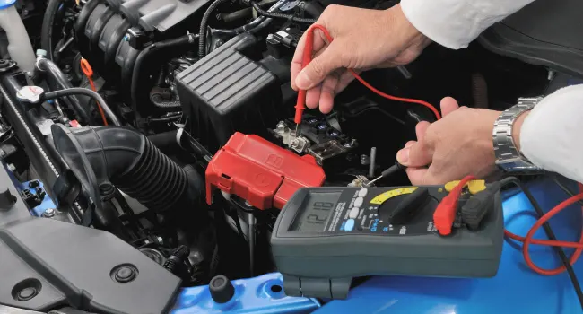 Service Offer - Battery Testing Special Oil being poured into engine