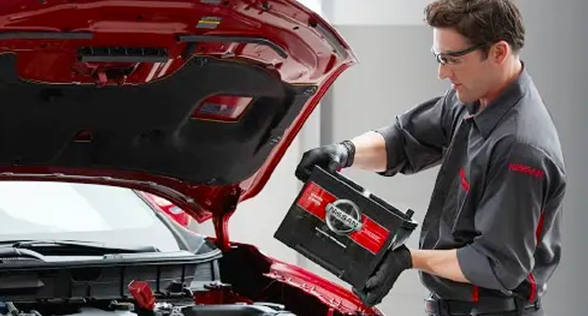 Service Offer - Battery Replacement Discount Technician replacing battery