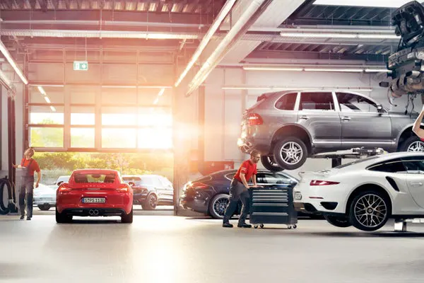 15% Off Factory Scheduled Service Mechanics Working in Porsche Service Shop