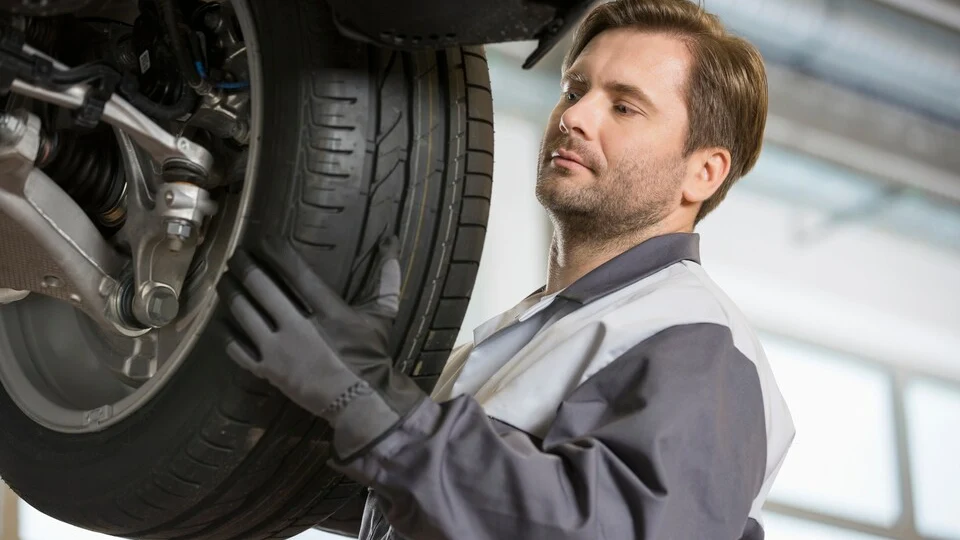 Volvo technician rotating a tire