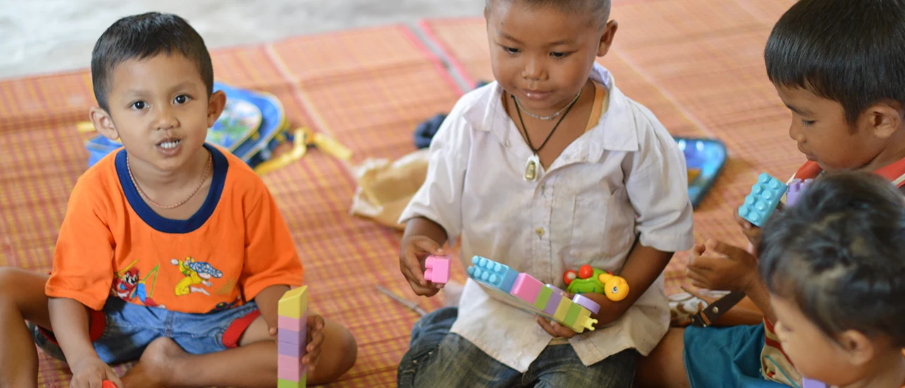 Young children playing with toys