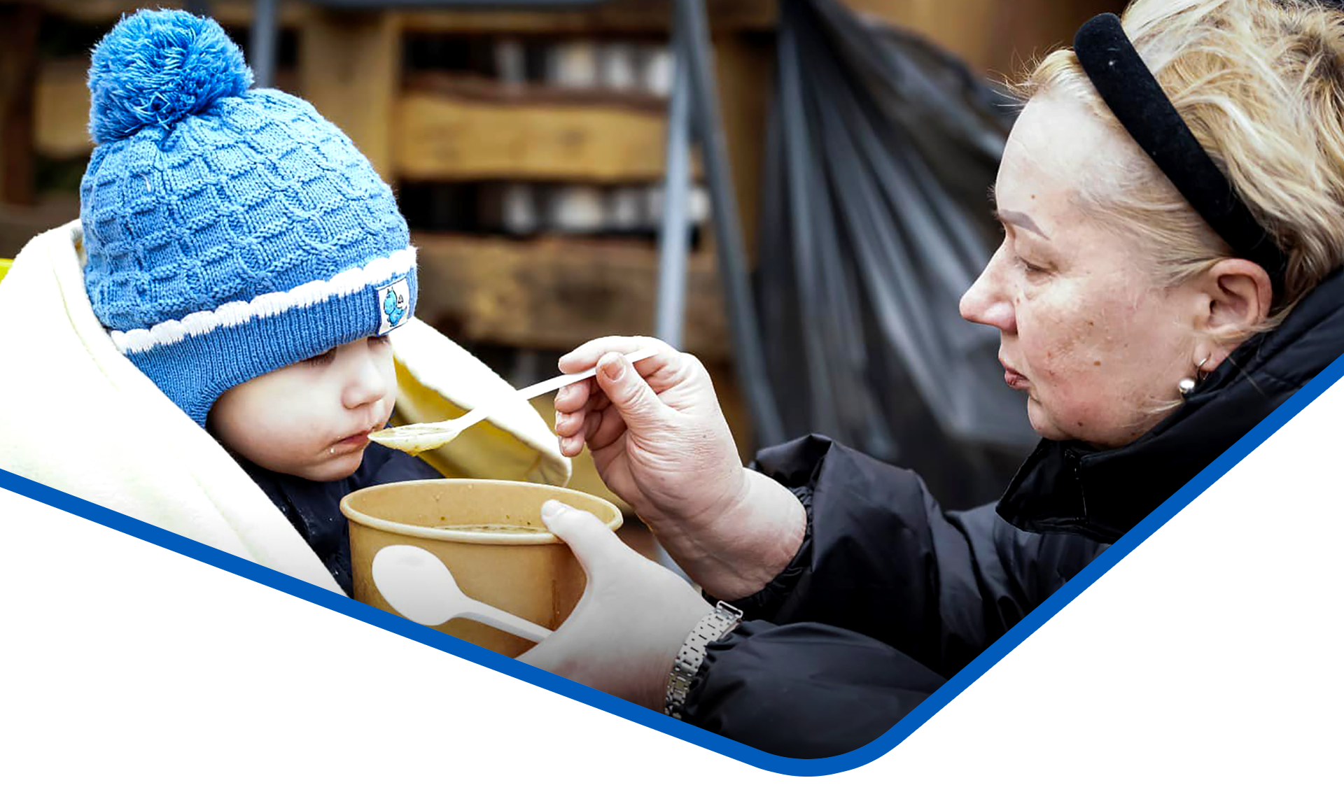 Woman feeding child