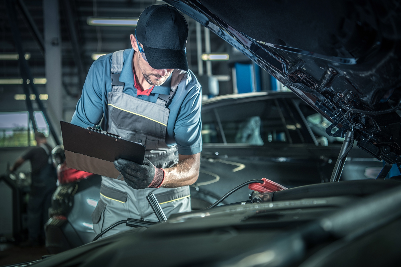 service technician checking engine