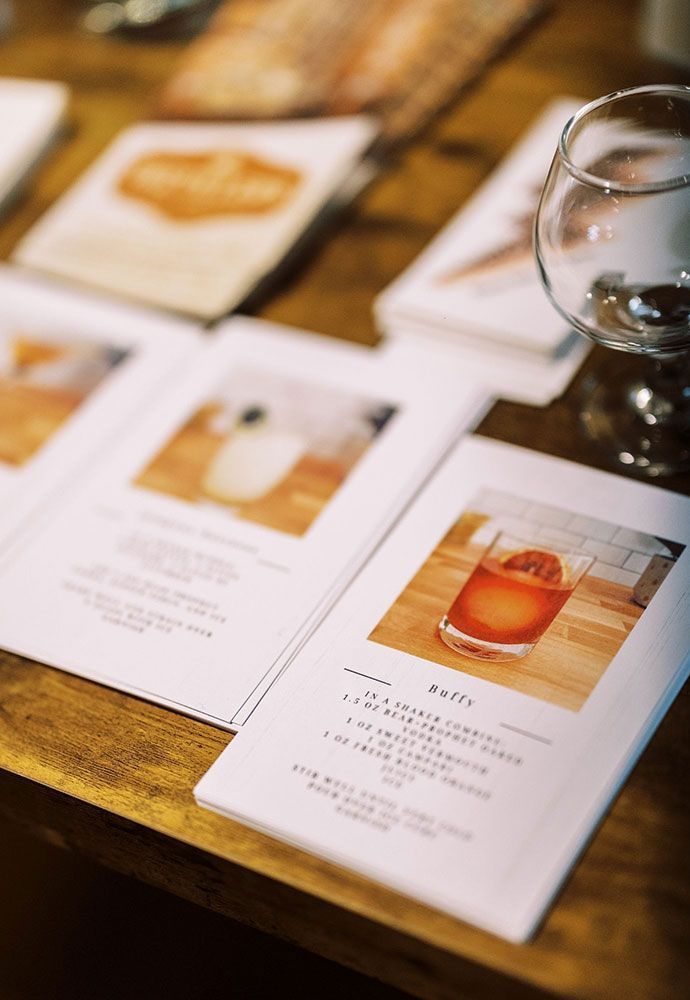cocktail recipe cards on table