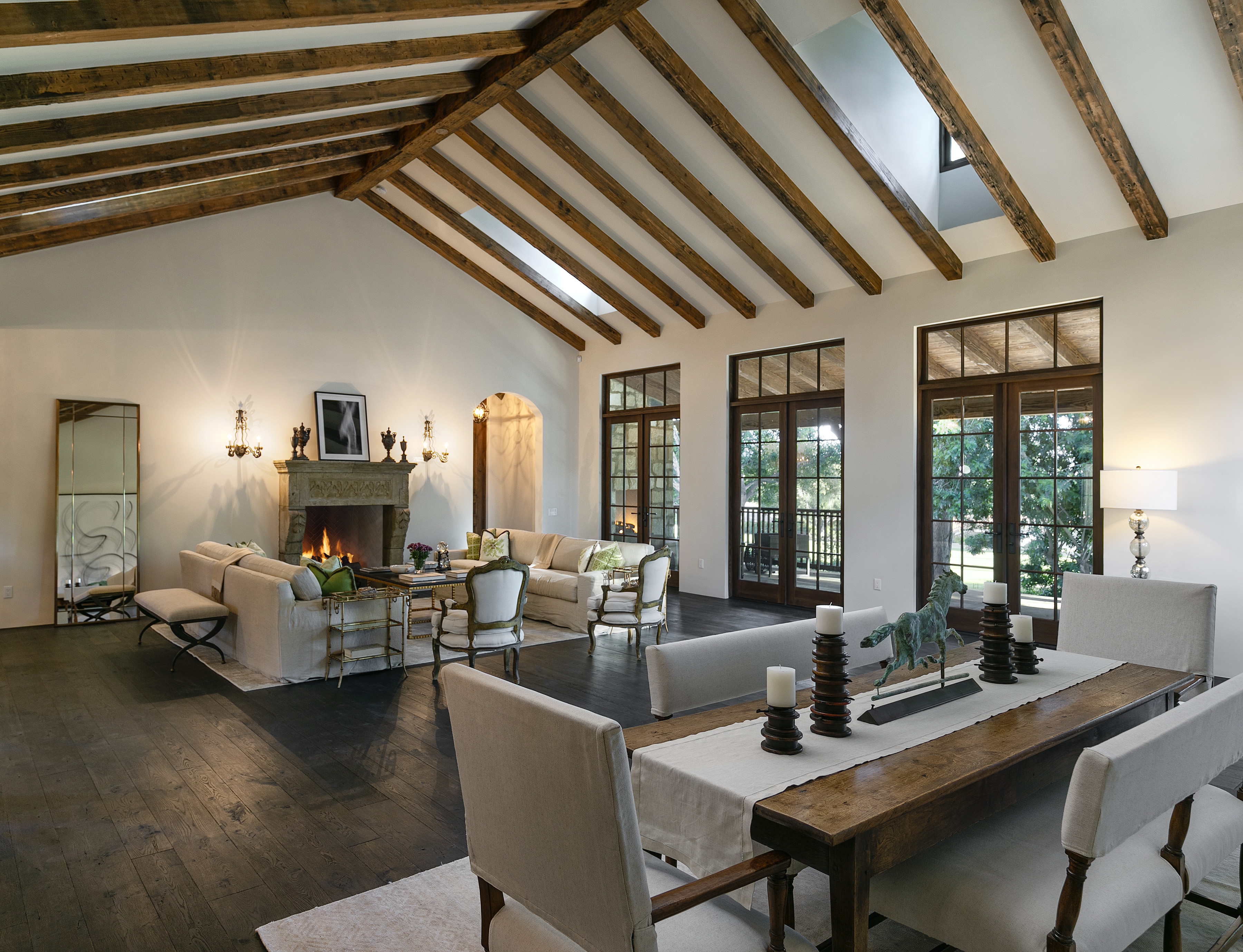 large open living and dining room area with vaulted ceilings