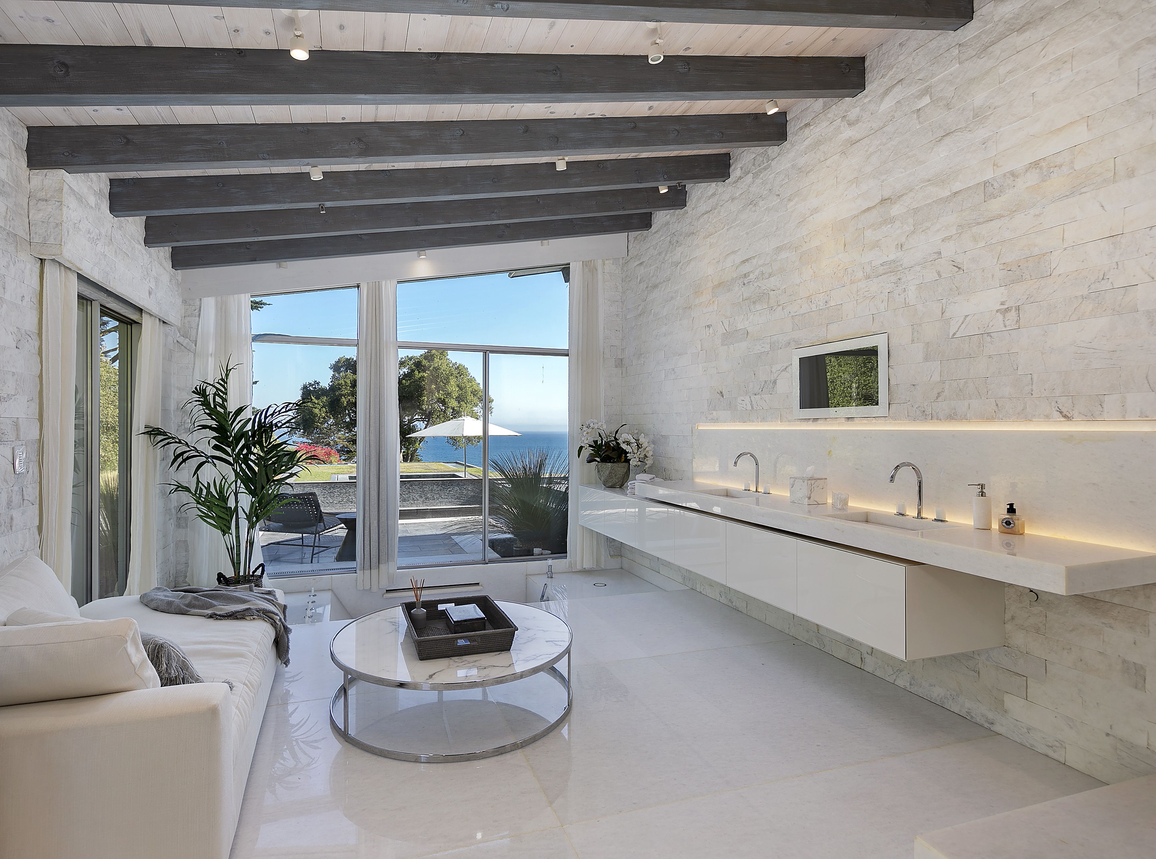 Luxury granite-lined bathroom with dual vanity in a dramatic Hope Ranch home