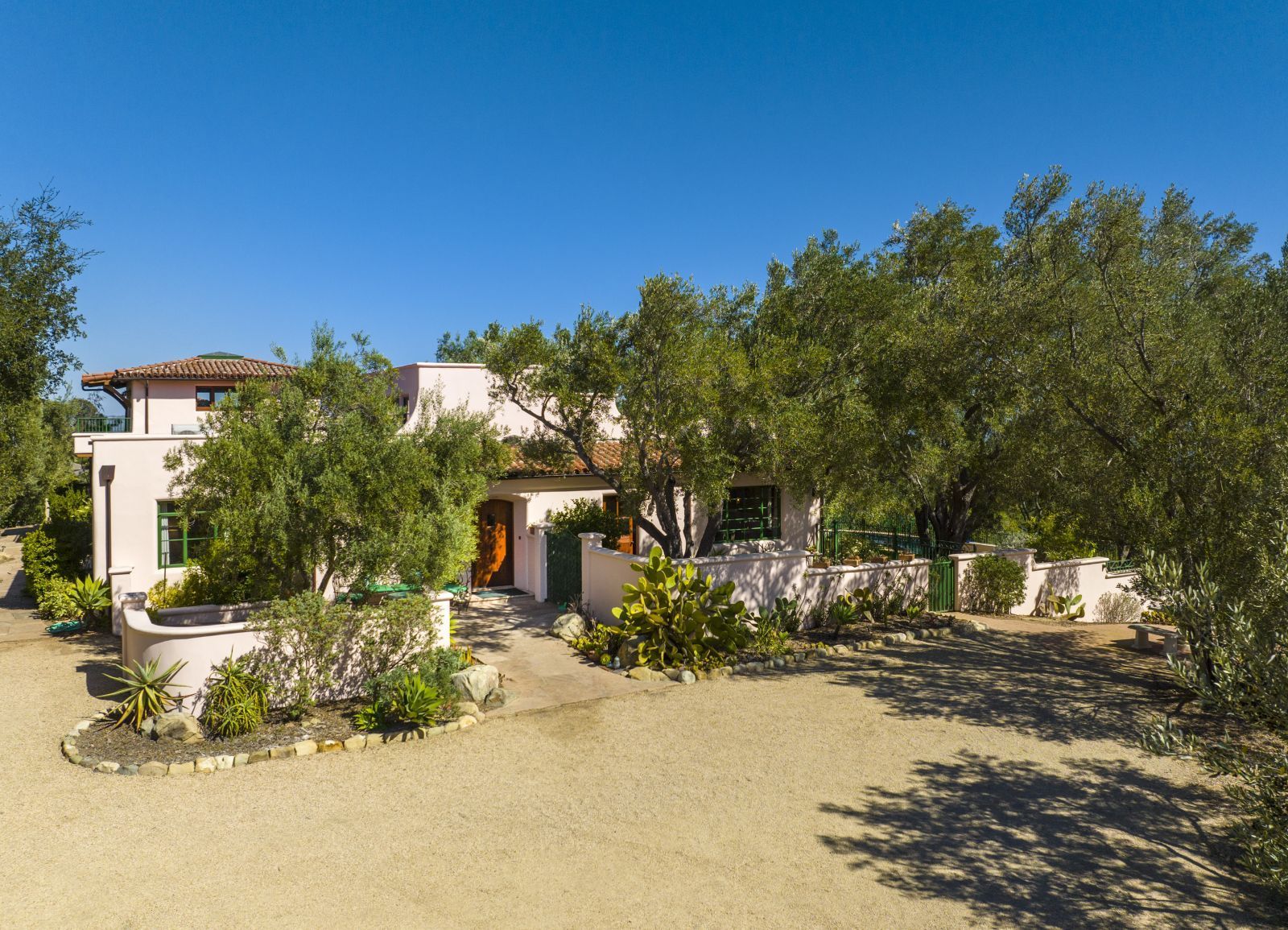 The motor court and courtyard of a stylish Montecito Spanish hacienda