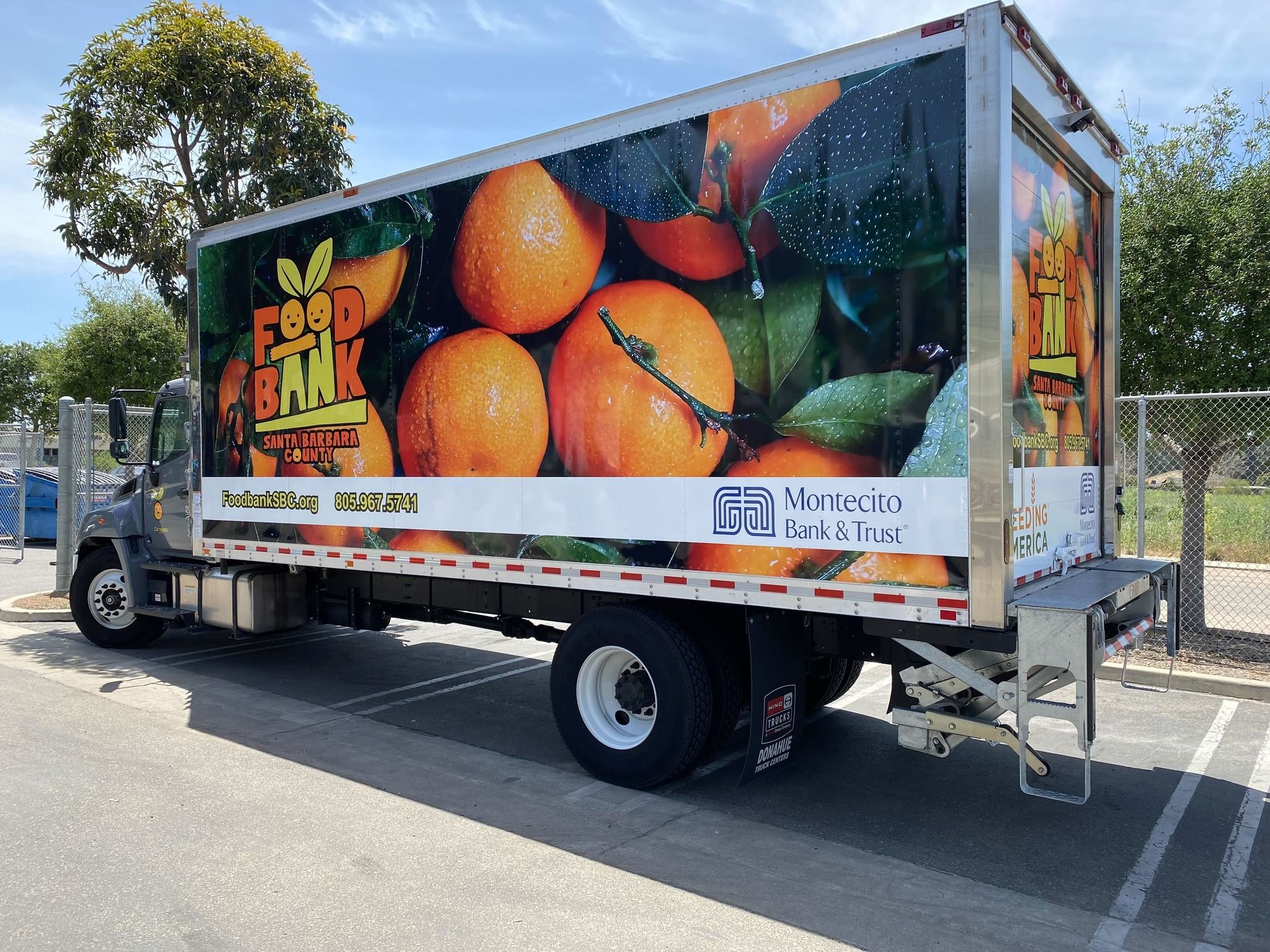 The Foodbank Santa Barbara County truck with vibrantly colored fruits and vegetables painted on the side.