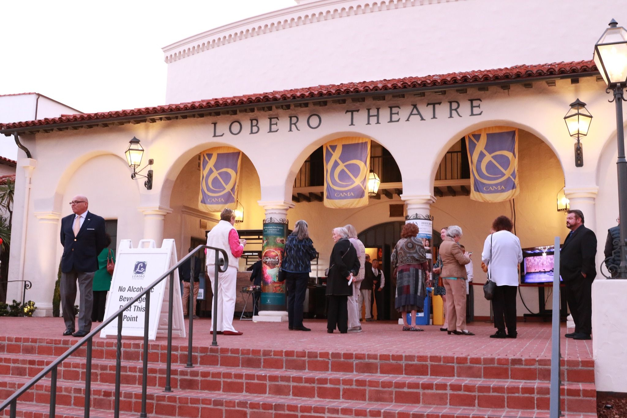 People dressed up for a night out in front of the Lobero Theater in Santa Barbara