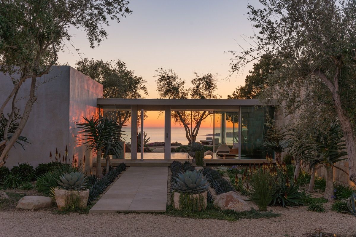 Sun setting behind a stunning Carpinteria home
