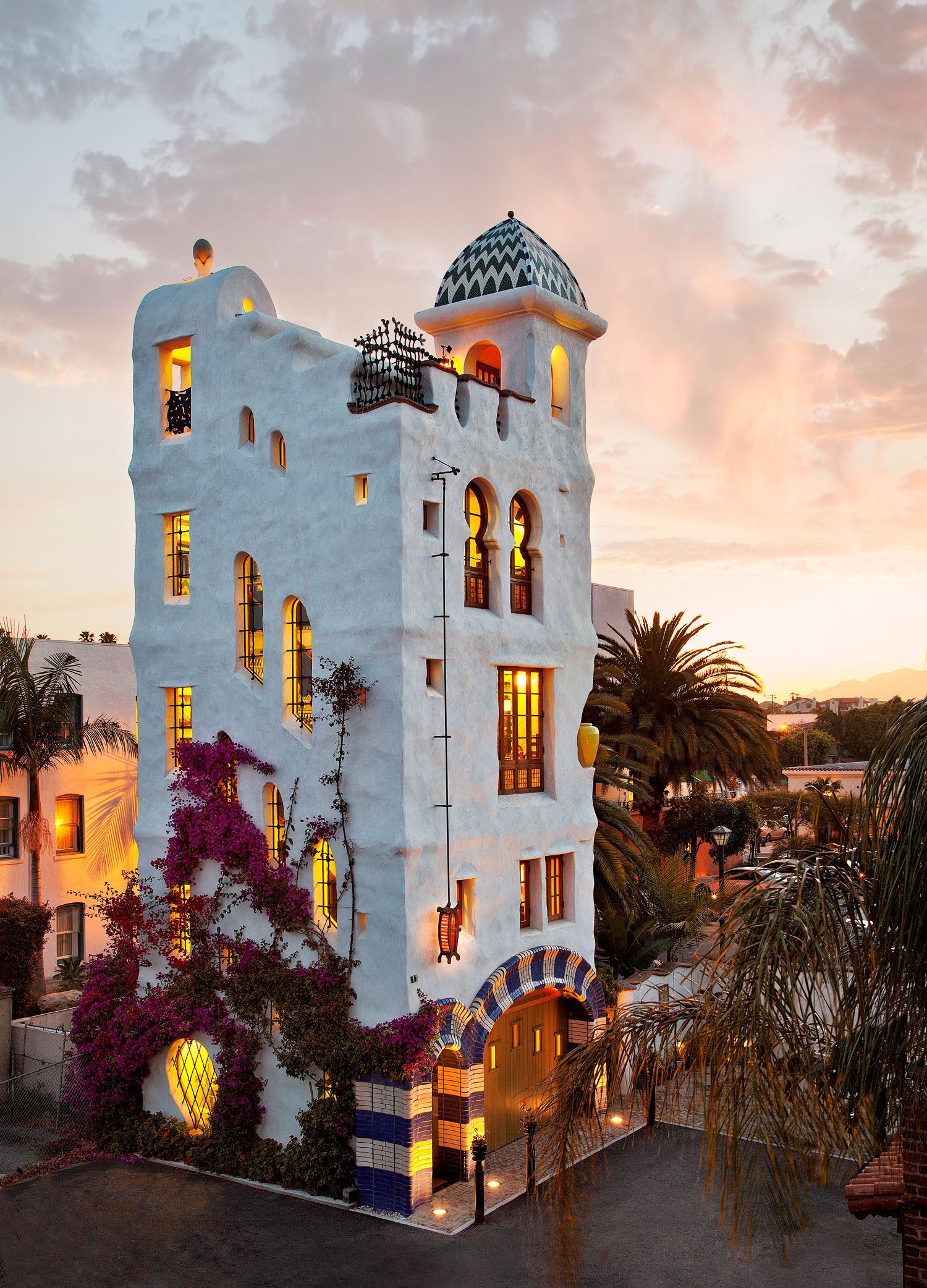 The Jeff Shelton-designed, 5-story, Ablitt Tower near downtown Santa Barbara, displaying the architect's whimsical, Dr. Seuss-like design elements, and illuminated from within at dusk.