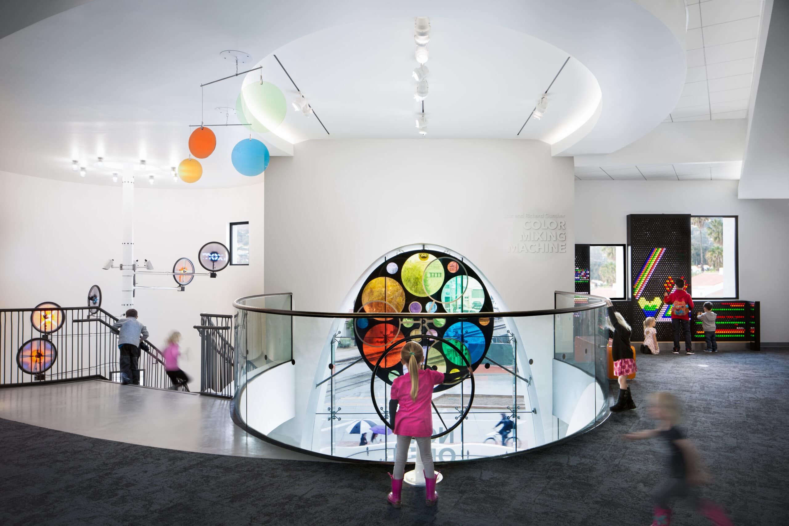 Children exploring an exhibit room at MOXI