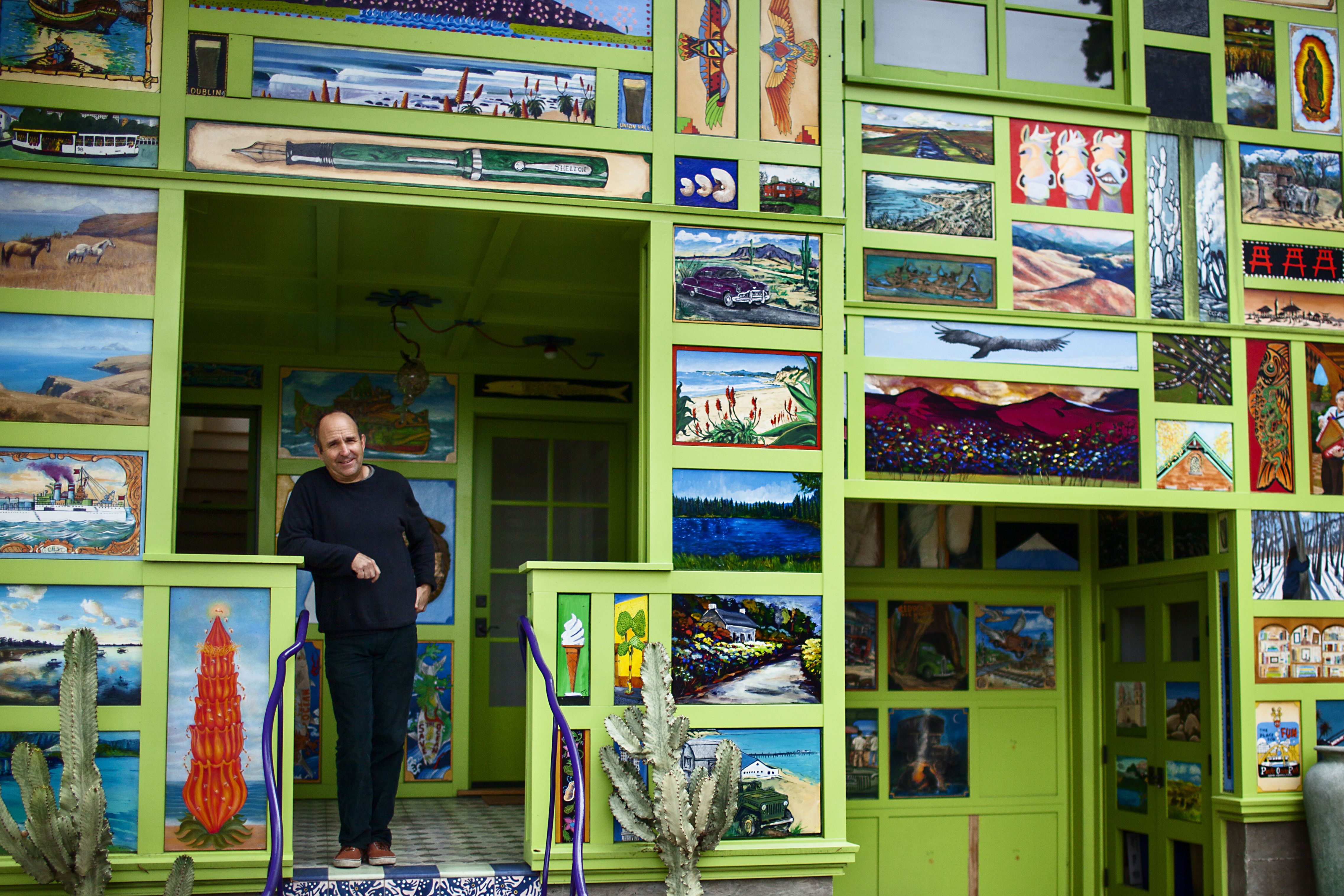 Santa Barbara architect Jeff Shelton standing in the doorway of the lime green and poster-covered.