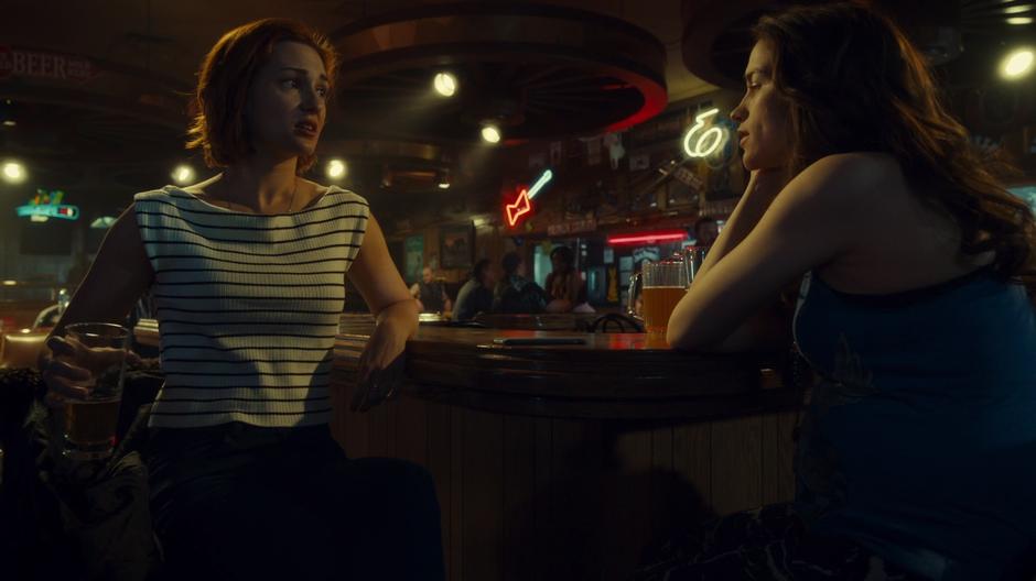 Nicole sits at the bar with Wynonna and asks why they are at the strip club.