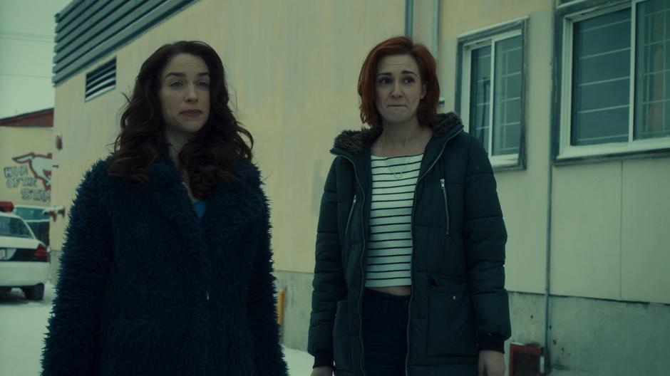 Wynonna looks over at her sister while Nicole tries to play it cool.