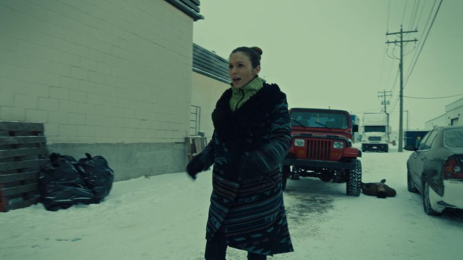 Waverly walks up to her sister and girlfriend while Jonas lies on the ground where he was knocked out by her.