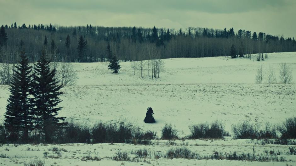 One of the Widows travels across the snowy field towards the church.