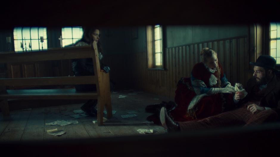 Wynonna watches as Constance Clootie tells Robert Svane about the Earp curse.