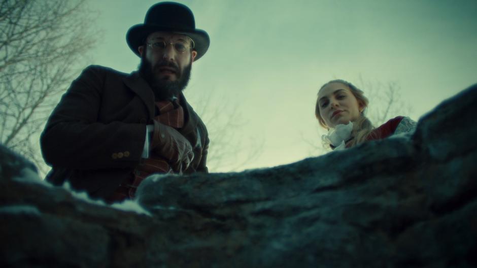 Robert Svane and Constance Clootie look down into the well where Doc Holliday is trapped.