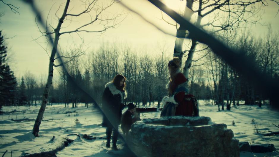 Wynonna watches as Constance Clootie leads Robert Svane to the well.