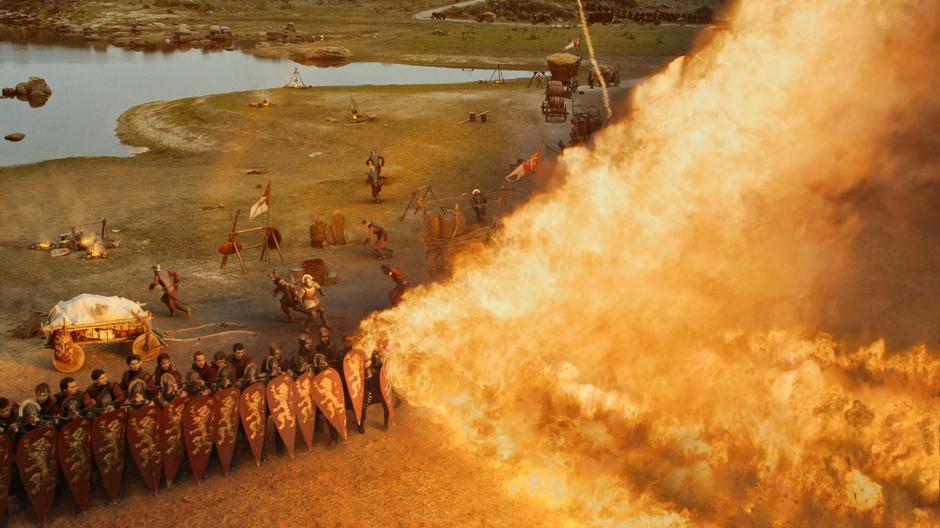 The dragon fire sweeps through the line of Lannister soldiers.