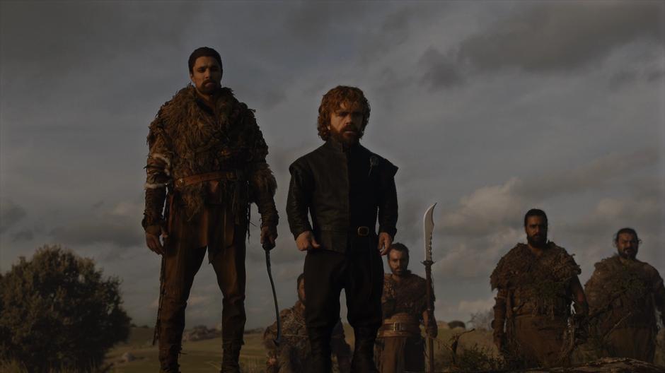 Tyrion watches the battle unfold from a nearby hilltop with a small group of Dothraki guards.