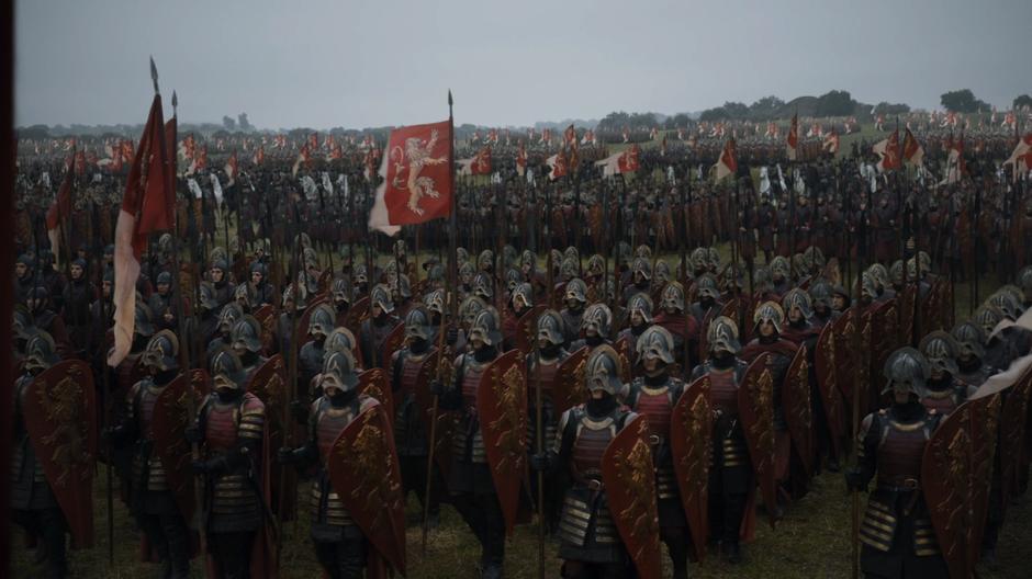 The Lannister army marches through the field.