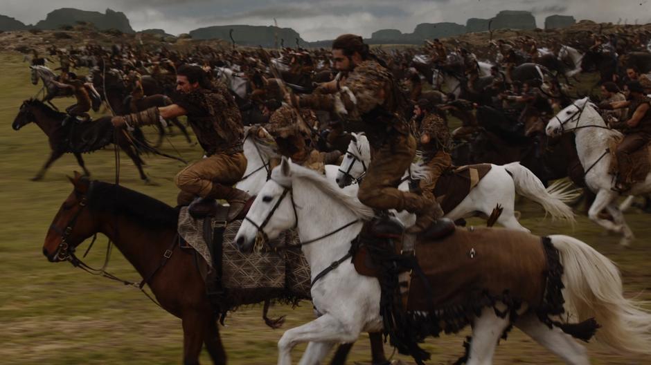 The Dothraki stand on their horses during the charge and fire their bows as the Lannister army.
