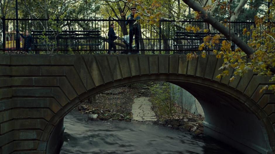 Simon calls down into the water from the bridge seeking entrance to the Seelie Realm.
