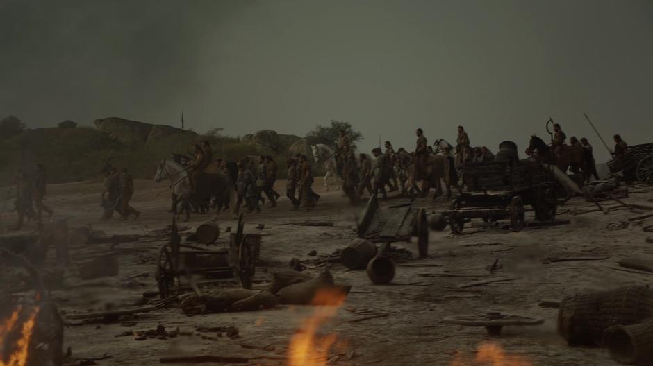 The Dothraki escort the living Lannister soldiers through the battlefield.