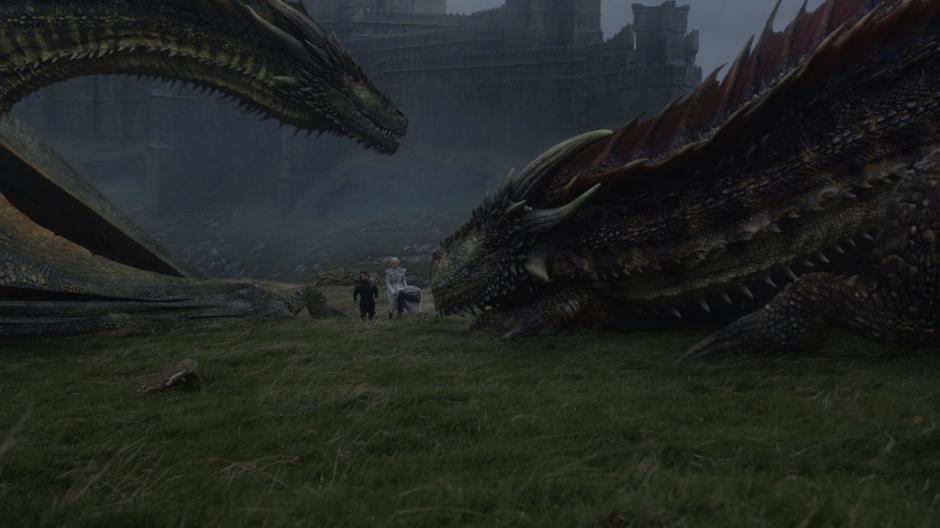 Tyrion walks with Daenerys as the dragons wake up around them.