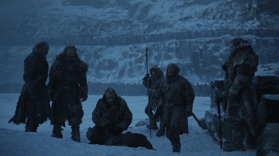 The survivors stand over the body of Thoros of Myr who died during the night.