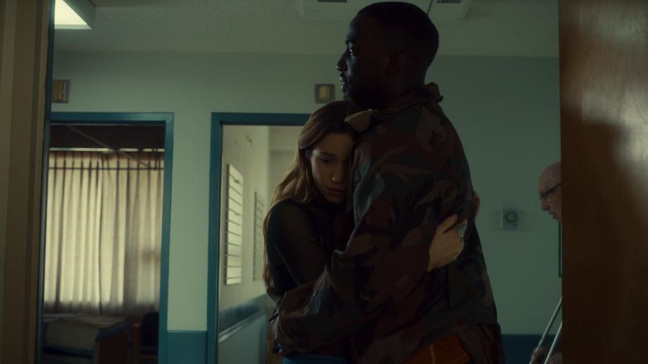 Waverly hugs Dolls in the hall of the hospital.