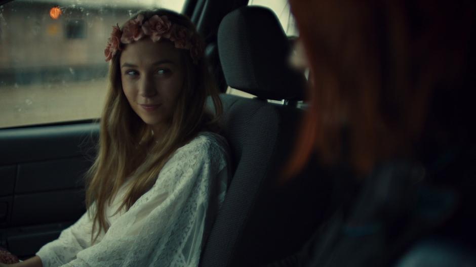 Waverly smiles at Nicole across the car.